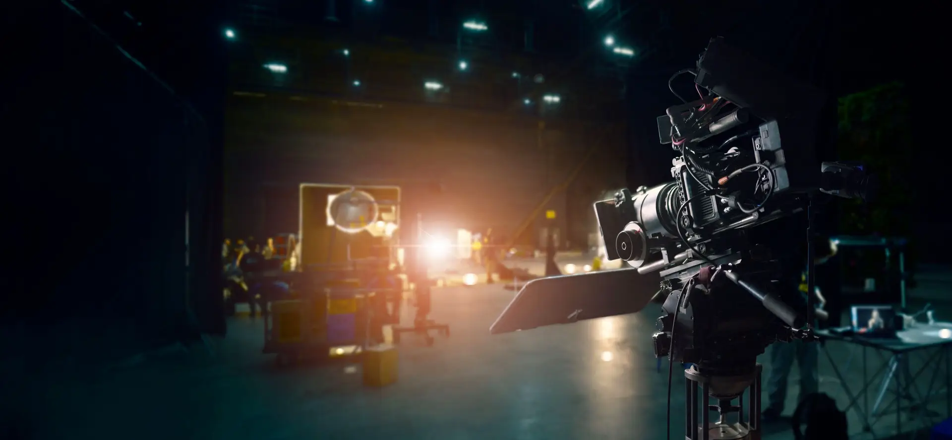 behind the scenes of making of movie and tv commercial. camera of movie and video production. film crew. b roll, and crew team in studio and set on dark background